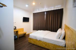 Postel nebo postele na pokoji v ubytování Mesra Boutique Hotel + 6 fotografií