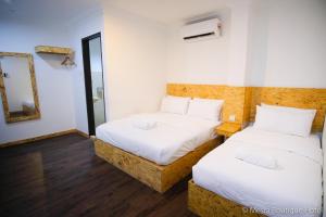 Postel nebo postele na pokoji v ubytování Mesra Boutique Hotel
