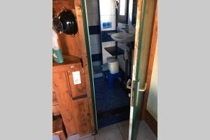 a bathroom with a sink and a mirror at Location Nuit Studio Port Gruissan in Gruissan +37 photos
