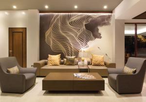 a living room with a couch and a coffee table at The Marison Hotel in Legazpi