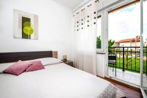 Posteľ alebo postele v izbe v ubytovaní Apartments Euphemia