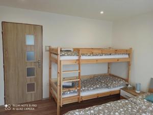 Postel nebo postele na pokoji v ubytování Apartmán u Vrbů