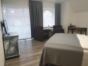 Postel nebo postele na pokoji v ubytování Hotel Blischke