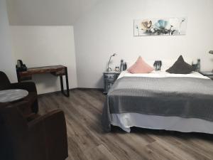 Postel nebo postele na pokoji v ubytování Hotel Blischke