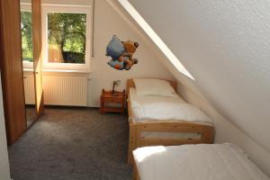Postel nebo postele na pokoji v ubytování Ferienhaus Groß Popkenhausen