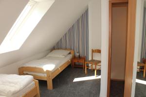 En eller flere senger på et rom på Ferienhaus Groß Popkenhausen