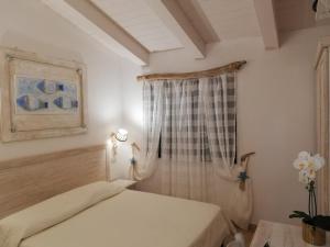 Postel nebo postele na pokoji v ubytování Hotel Tabby