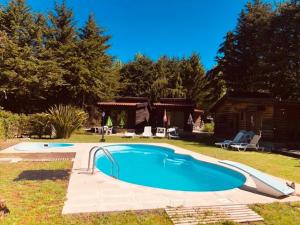 a swimming pool in the yard of a house at Quinta Sul America in Moimenta da Beira