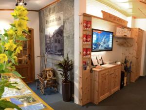 a store room with a counter and a plant at Alpenblick in Zermatt