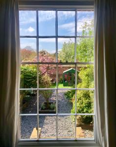 a window with a view of a garden outside at The Townhouse Central York in York