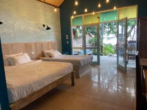 Cama o camas de una habitación en Heaven Beach Resort & Art