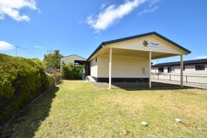 a house with a garage with a spider on it at The Lazaret in Kingscote