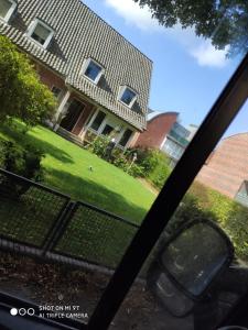 a view of a house from the inside of a car window at The Old Doctors Office in Hamburg