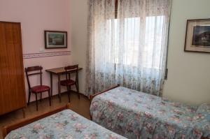 Letto o letti in una camera di Albergo De Jean