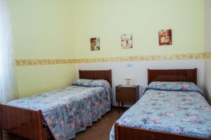 Katil atau katil-katil dalam bilik di Albergo De Jean
