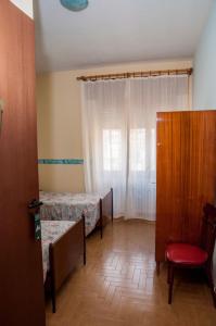 Letto o letti in una camera di Albergo De Jean