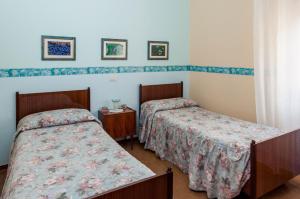 Letto o letti in una camera di Albergo De Jean