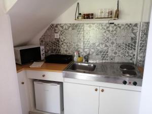 Kuchyň nebo kuchyňský kout v ubytování Gesztenye Vendégház + 37 fotografií