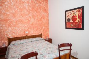 Letto o letti in una camera di Albergo De Jean