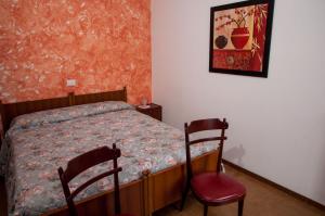 Letto o letti in una camera di Albergo De Jean