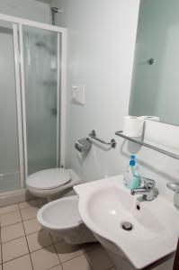 a bathroom with a toilet and a sink at Albergo De Jean in Garzeno