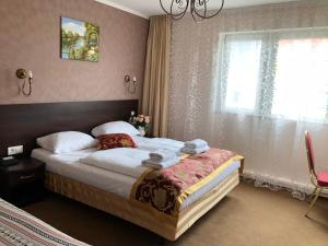 Postel nebo postele na pokoji v ubytování Atlas Berlin Hotel