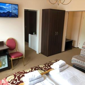 Postel nebo postele na pokoji v ubytování Atlas Berlin Hotel