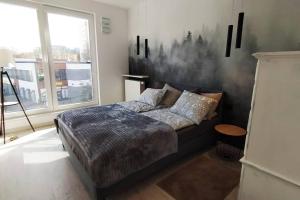 Ένα ή περισσότερα κρεβάτια σε δωμάτιο στο Modern Home Moldawska