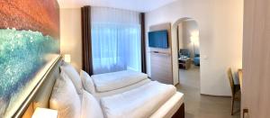Ein Bett oder Betten in einem Zimmer der Unterkunft Thermalhotel Kemper