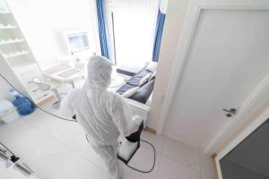 a person is in a room with a vacuum at Granada City in Alanya