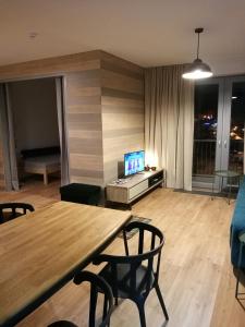 TV a/nebo společenská místnost v ubytování Apartmán 18 - Jestřáb