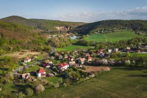 an aerial view of a small village in the hills at Privát Ľubica in Fiľakovo