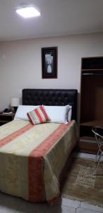 Ein Bett oder Betten in einem Zimmer der Unterkunft Hotel Athenas e Convenções