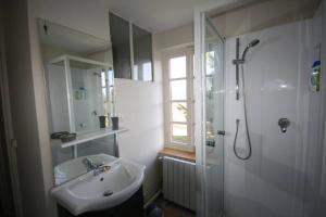a bathroom with a sink and a shower and a sink at La Fount del Fer in Camarade