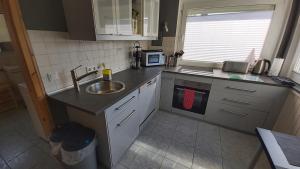 Kuchyň nebo kuchyňský kout v ubytování Ferienhaus Zur Lehns mit Garten am Harz + 10 fotografií
