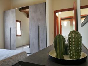 A bed or beds in a room at La Casa dell'Orologio