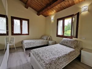 A bed or beds in a room at La Casa dell'Orologio