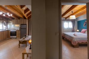 a kitchen and a bedroom with a bed in a room at Nefeli seaview apartment in Argostoli +34 photos