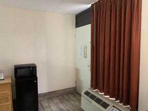 TV in/ali zabaviščno središče v nastanitvi Super Inn