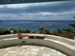 a view of the ocean from a balcony at Villa Ioanna Tinos in Kionia
