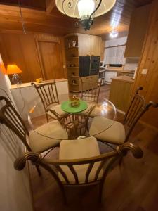 a kitchen and dining room with a table and chairs at Chalet Burglauenen Grindelwald in Grindelwald