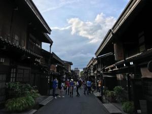 a group of people walking down a street at BEYOND HOTEL Takayama 2nd - Vacation STAY 82239 in Takayama