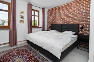 Łóżko lub łóżka w pokoju w obiekcie Blick Apartments - Riverview Soft Loft