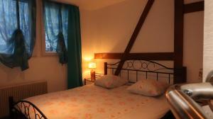 a bedroom with a bed with a wooden bed frame at Chalet Burglauenen Grindelwald in Grindelwald