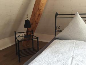 Postel nebo postele na pokoji v ubytování BnB Hopfengrün Langenthal