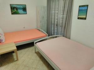 Postel nebo postele na pokoji v ubytování Apartmani Sofija