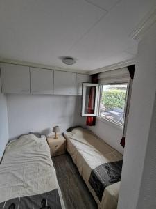 Een bed of bedden in een kamer bij Wuivend Riet gelegen op Resort Venetie