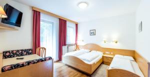 Postel nebo postele na pokoji v ubytování Hotel Vernel