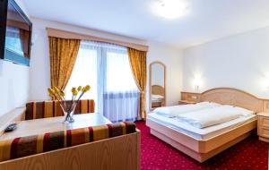 Postel nebo postele na pokoji v ubytování Hotel Vernel