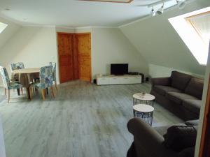 Posezení v ubytování Ferienwohnung auf Rügen in Maltzien + 7 fotografií
